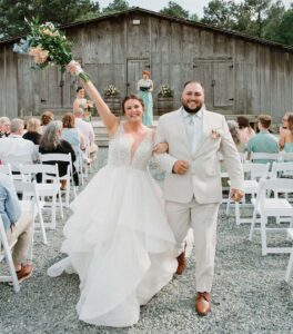 Bride and groom walking aisle after getting married